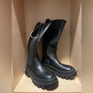 Black below knee height boots